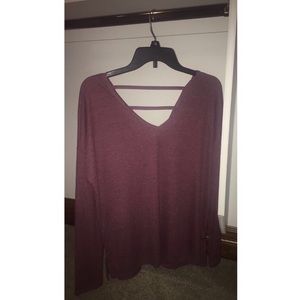 Plum colored long sleeve with bars across the back